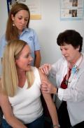 image of a lady receiving a fly shot